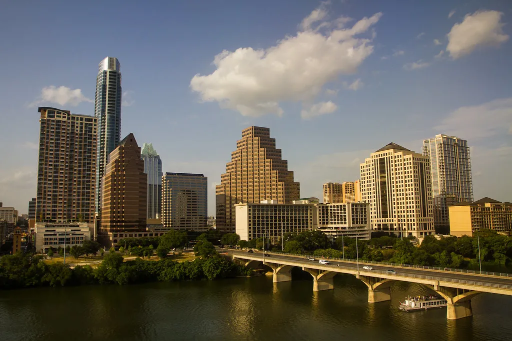 Downtown Austin skyline above Lady Bird Lake and the Congress Avenue Bridge